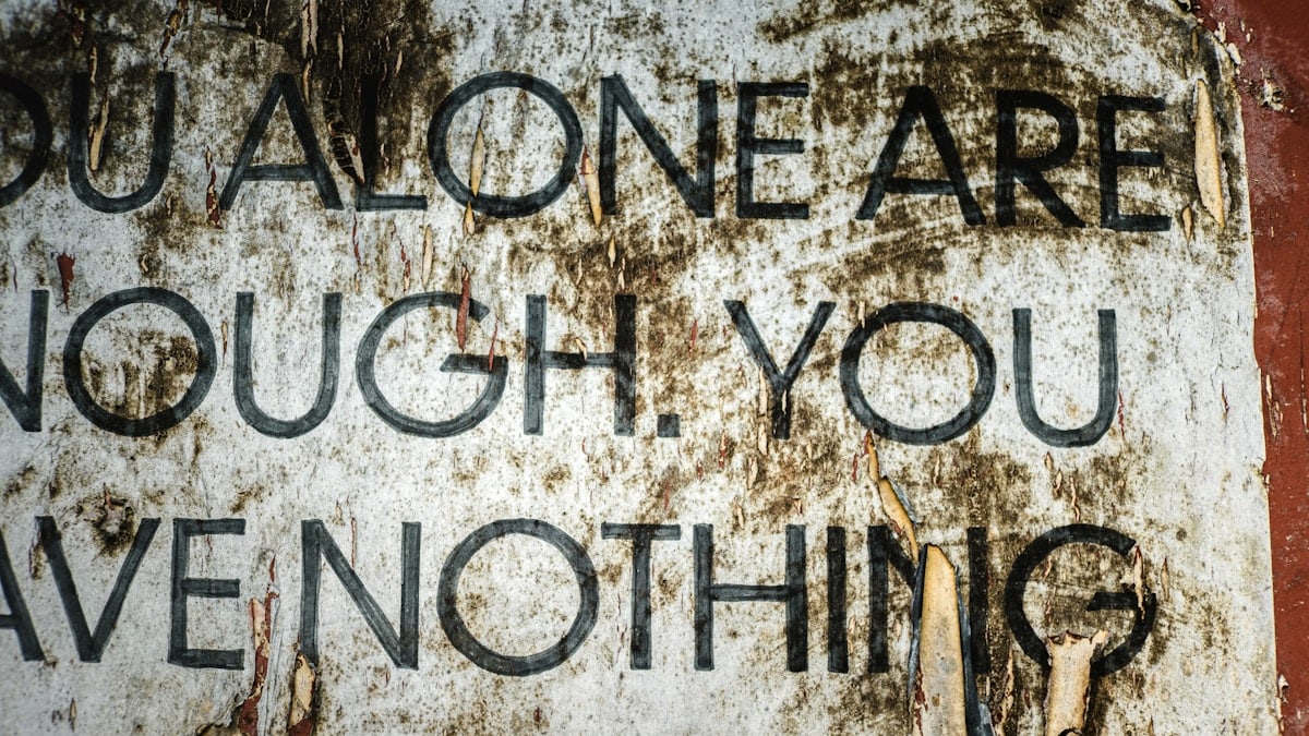 Torn poster with text about self-worth